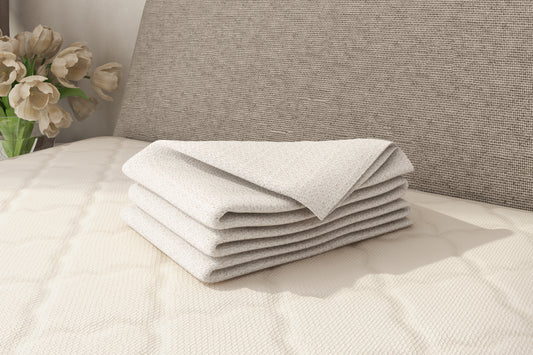 Certified organic cotton blanket displayed on a bed